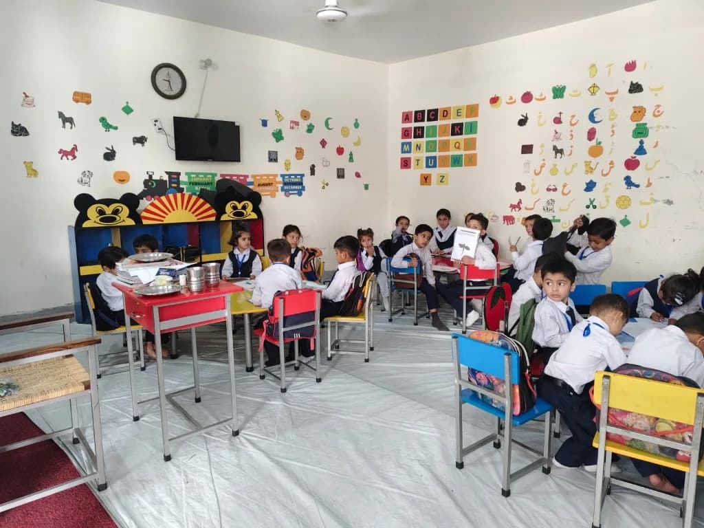 Children learning together in a Home of Joy classroom