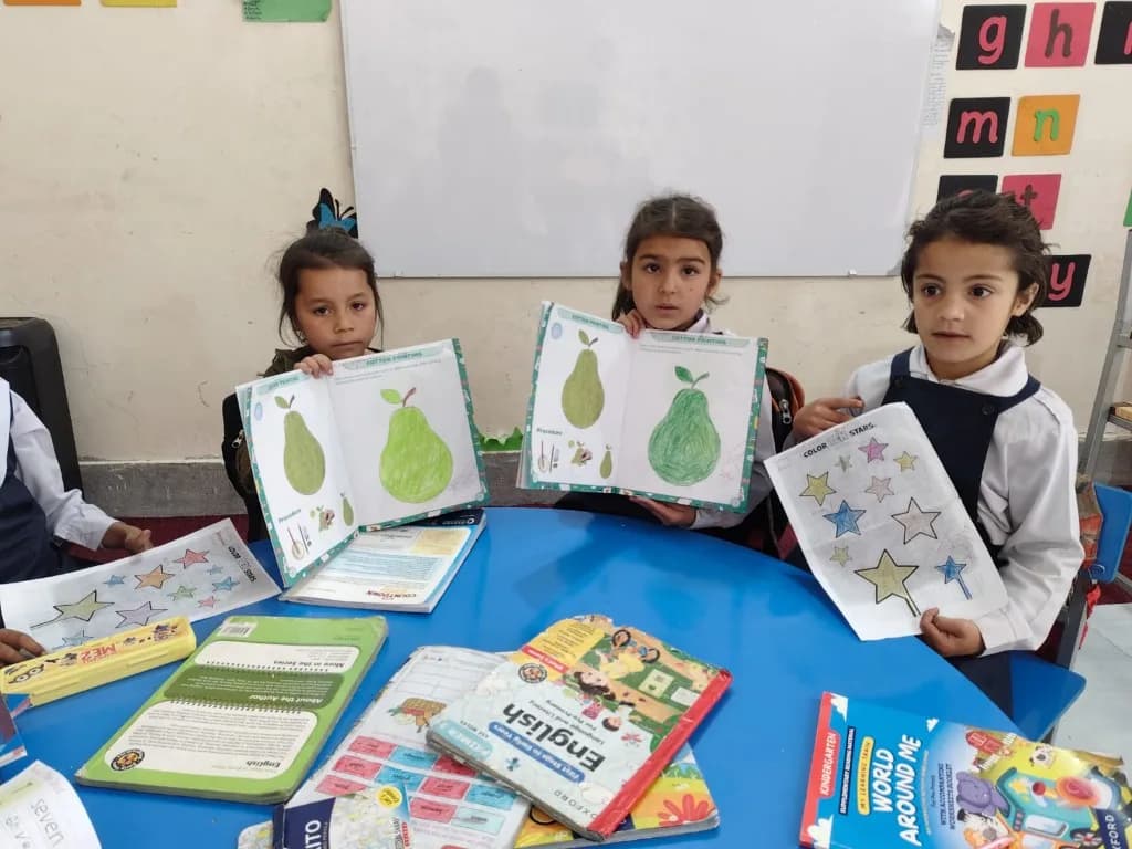 Girls showing cotton painting skill work