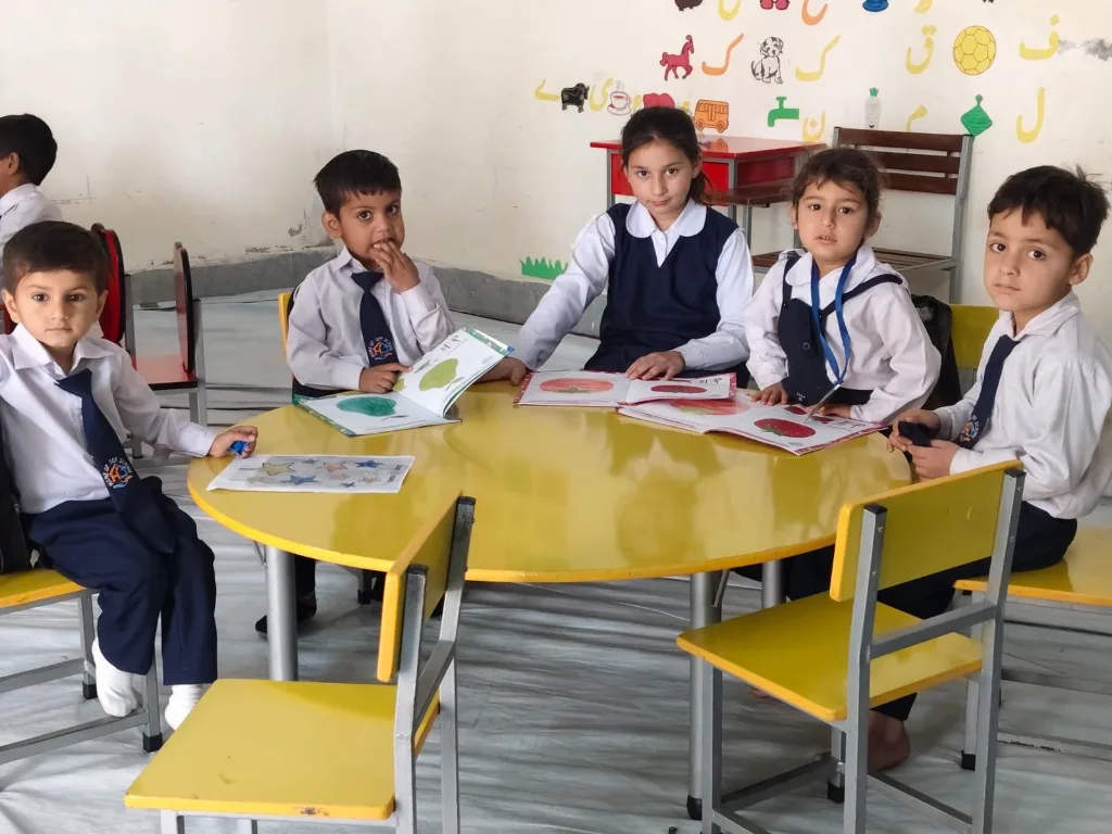 Students learning together in a Home of Joy classroom