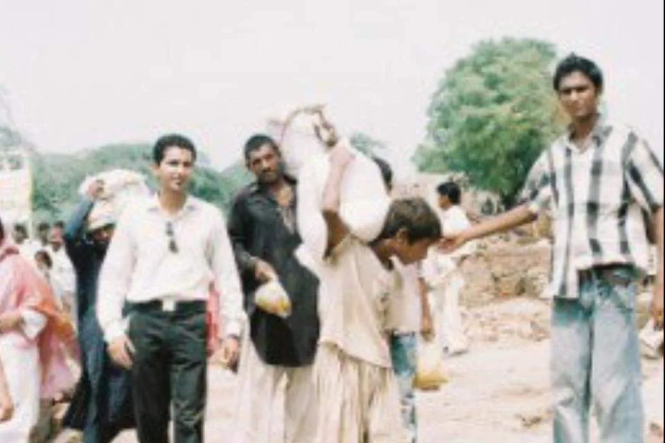Carrying food aid sacks